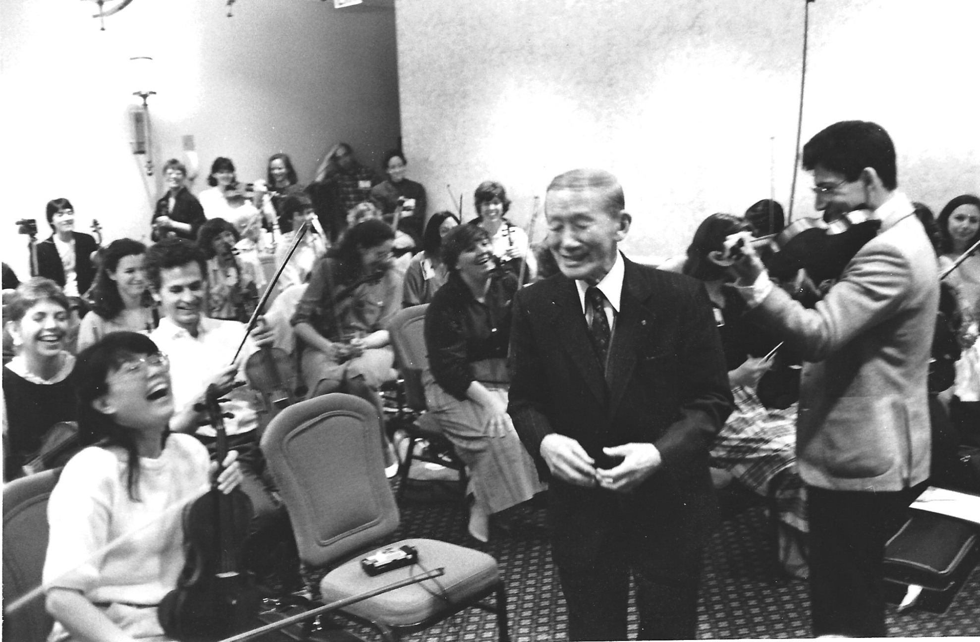 Dr. Suzuki laughing